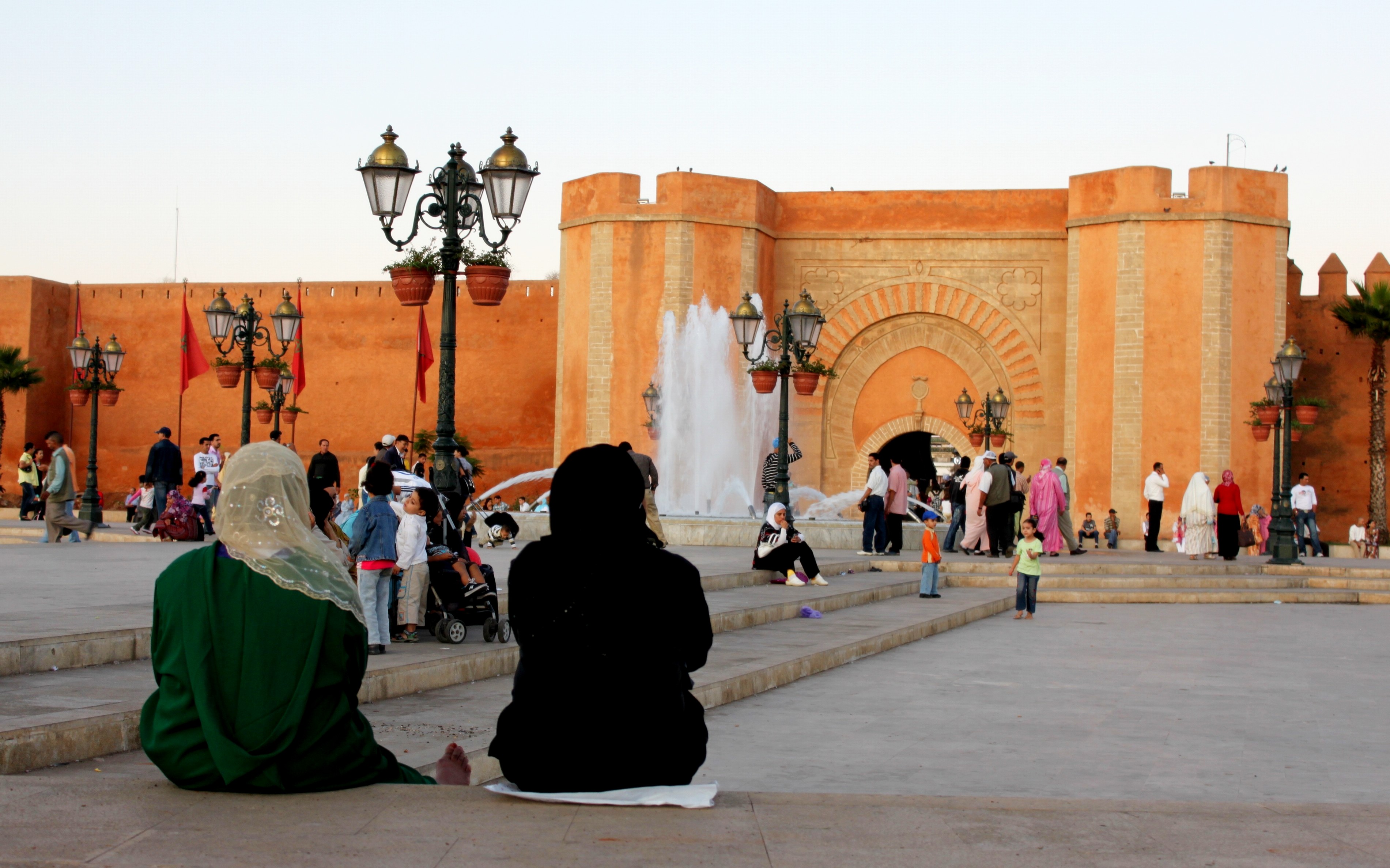 plaza square with two women sitting on ground