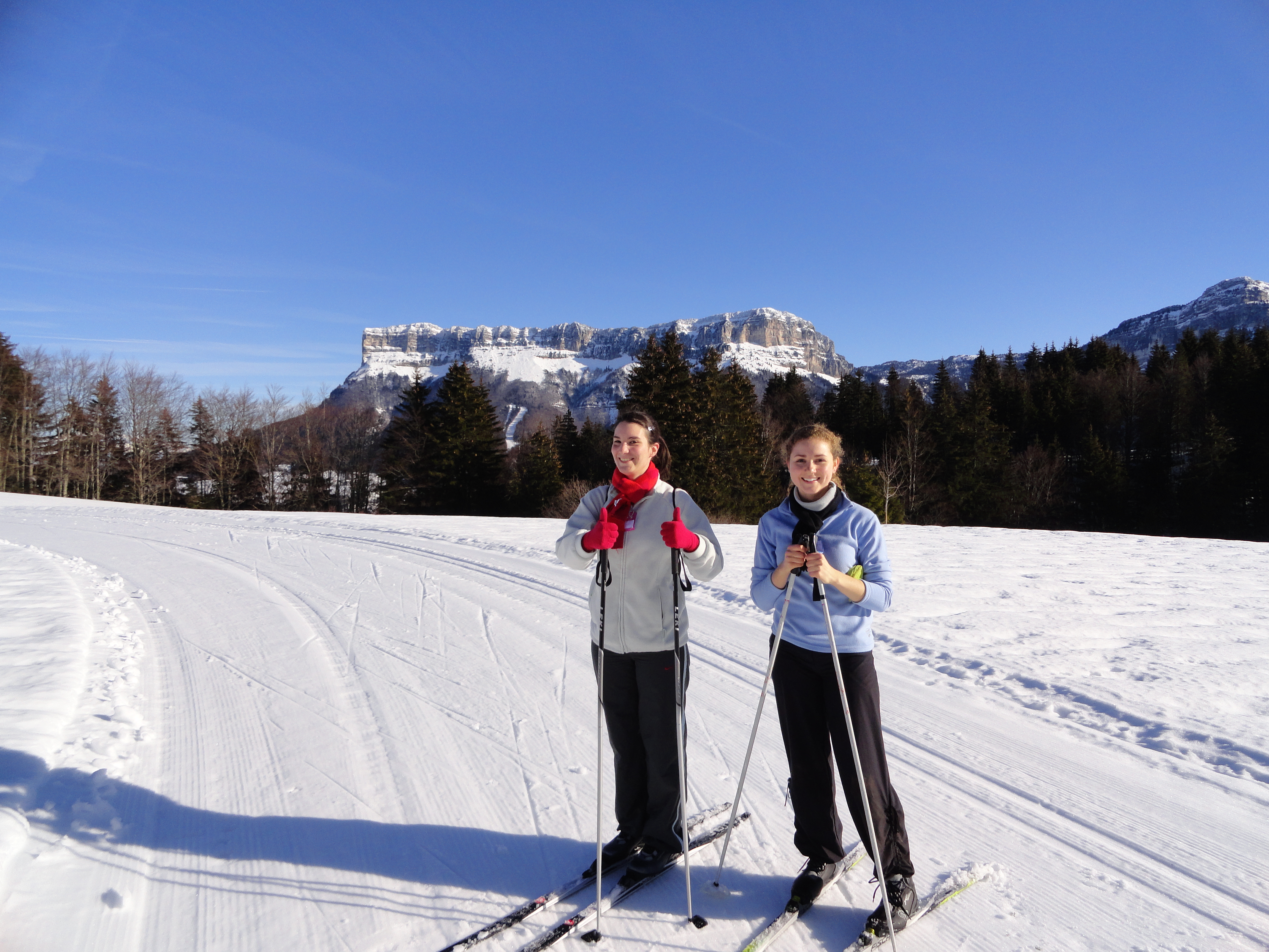 two students skiing