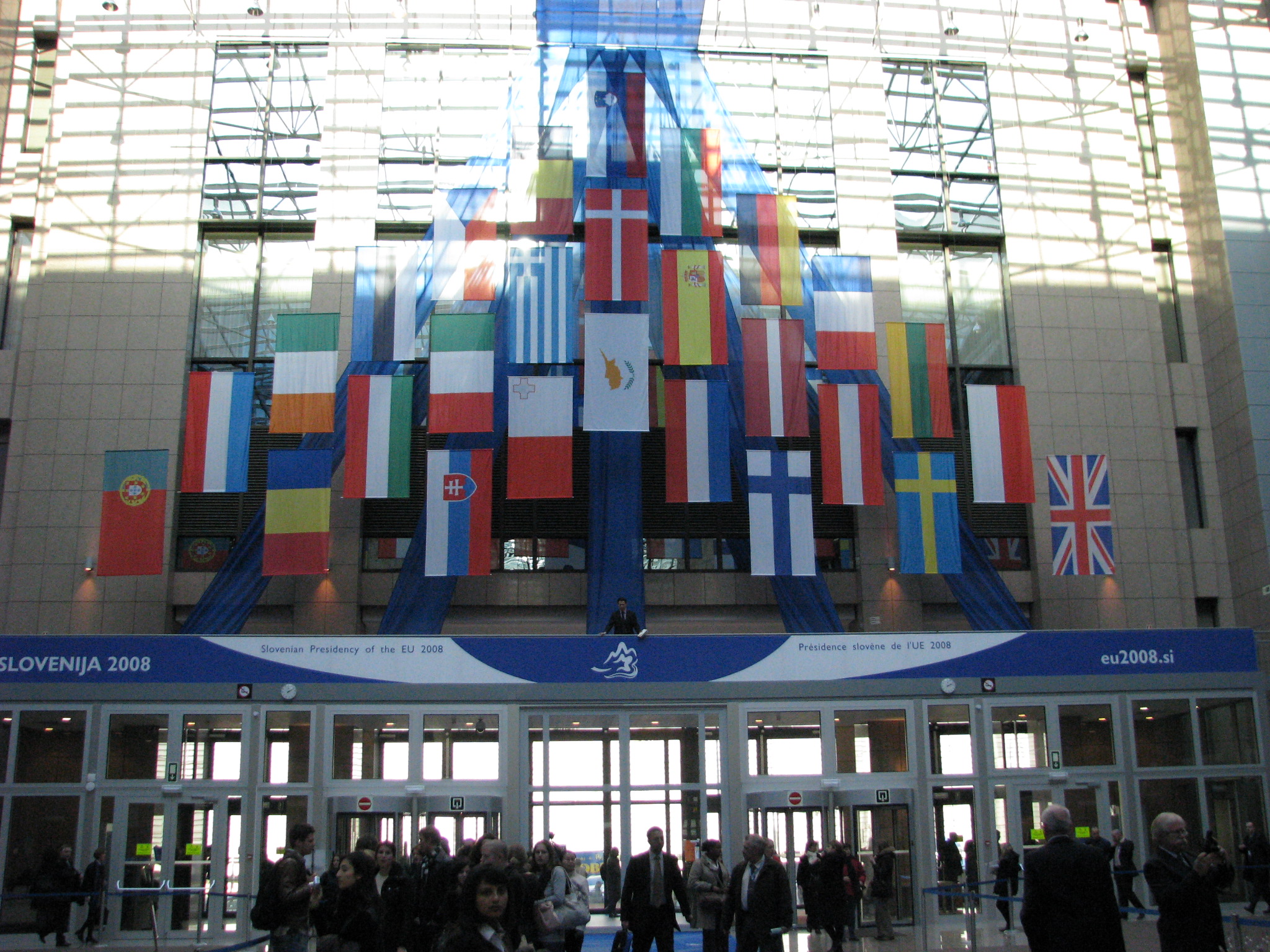 entrance to the EU Council building with flags overhead