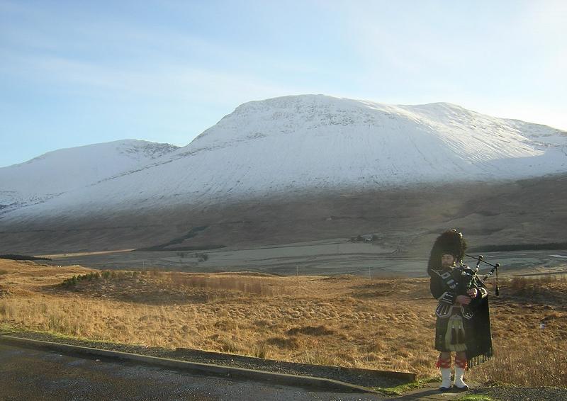 Piper on the Scottish Highlands